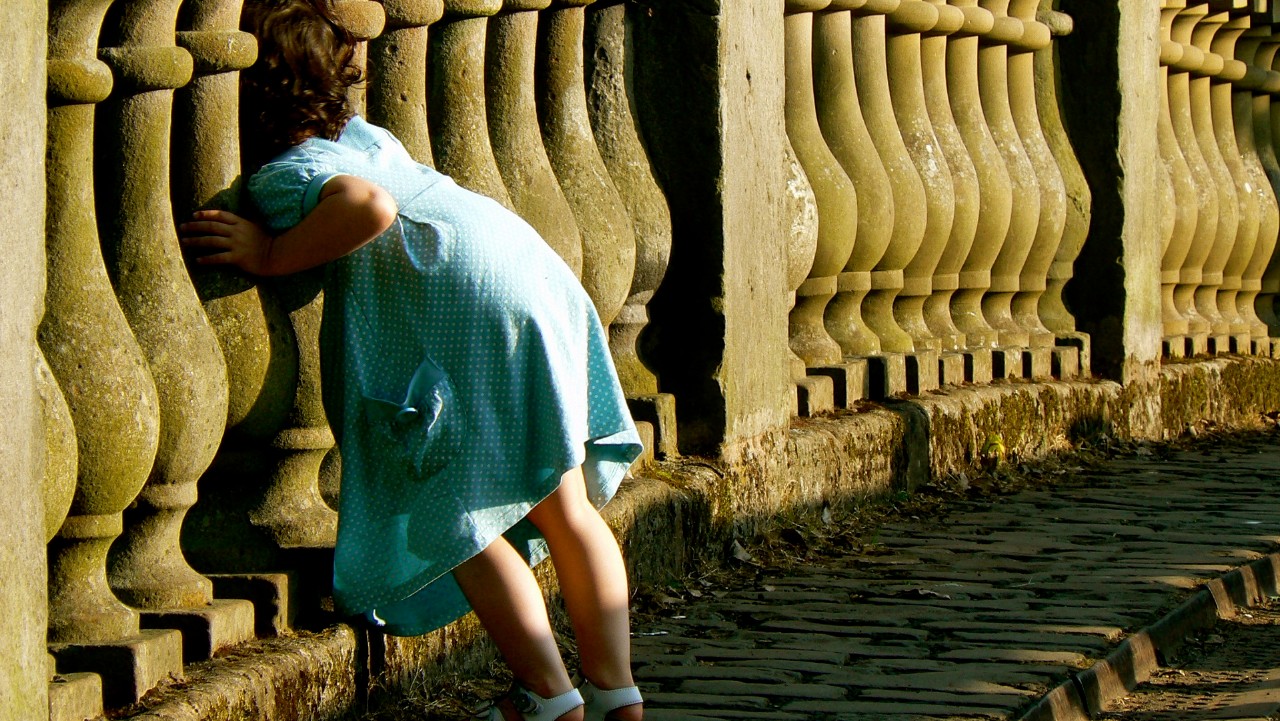 Child playing on a bridge in Glasgow